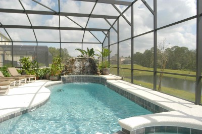 Pool and waterfall with lake view